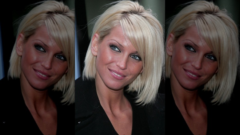 Closeup of Sarah Harding smiling to her right