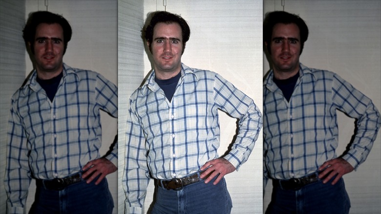 Andy Kaufman with his hand on his hip, leaning against a wall