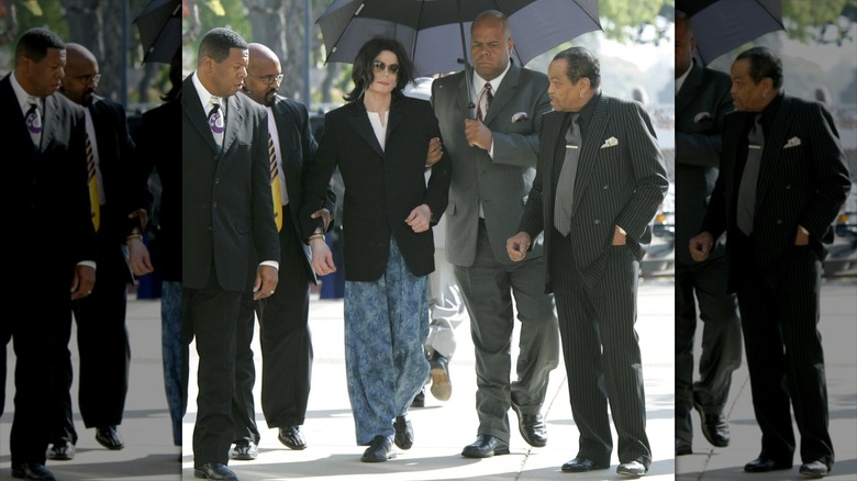 Michael Jackson walking to court with his entourage