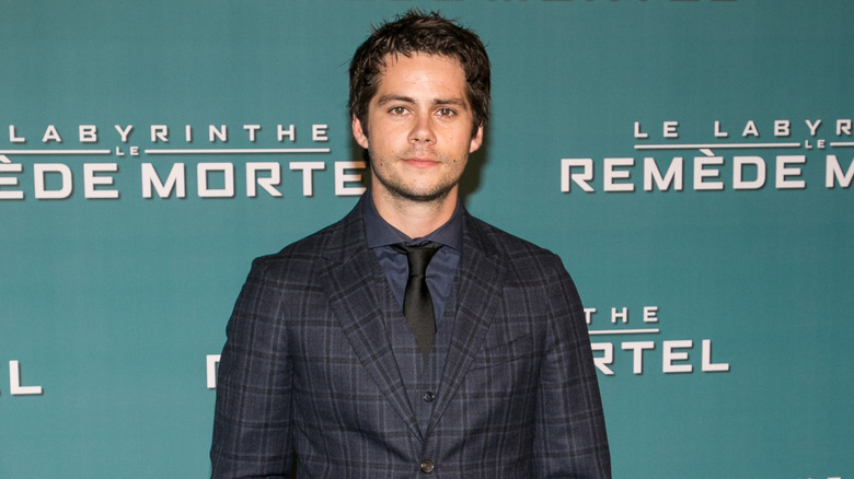 Dylan O'Brien in a checked tux at a French event for 'Maze Runner'