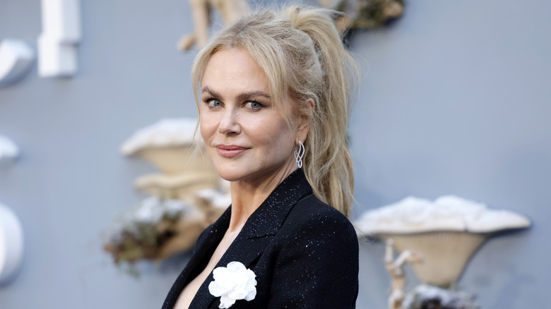 Nicole Kidman in a sparkly black coat and high ponytail