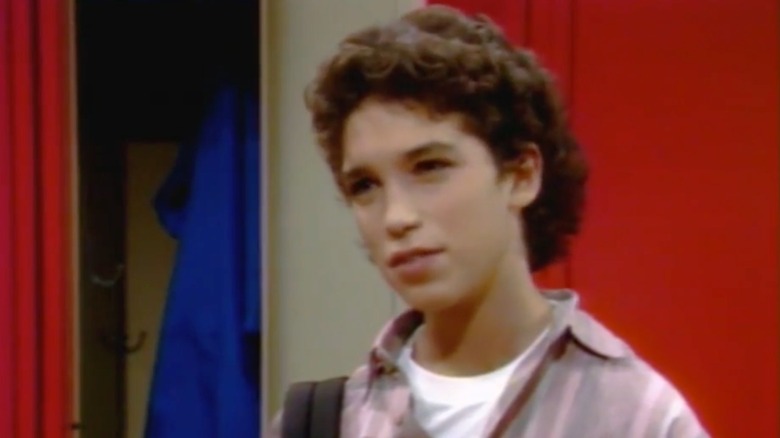 Max Battimo in front of a locker in an episode of "Good Morning, Miss Bliss"