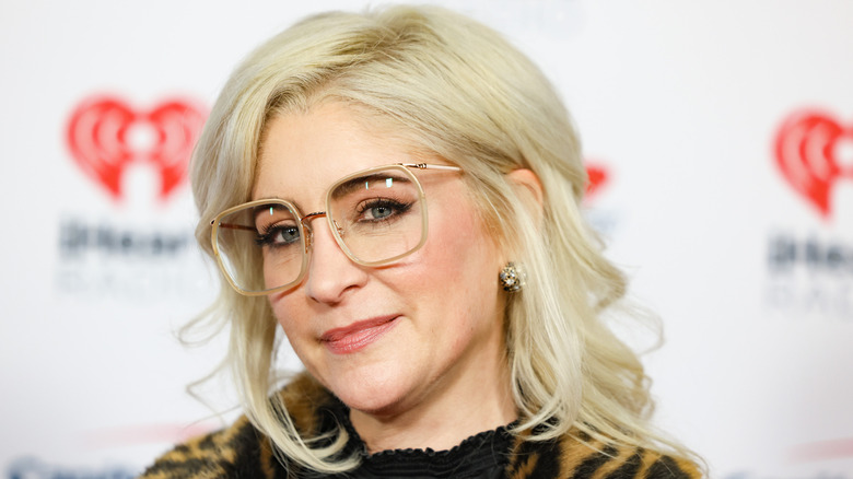 Staci Keanan posing on a red carpet at Jingle Ball in 2024