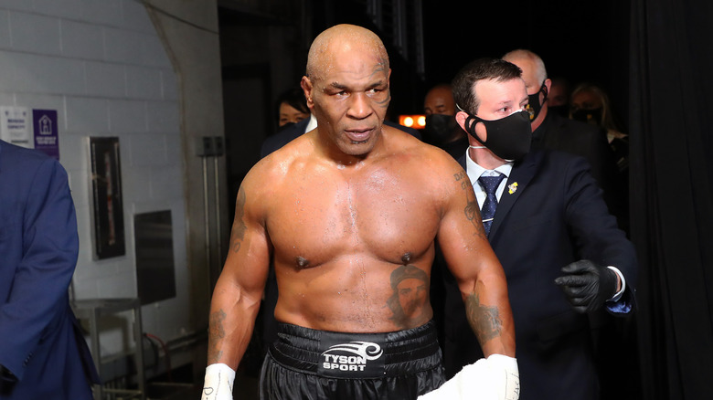 Mike Tyson in black boxing shorts