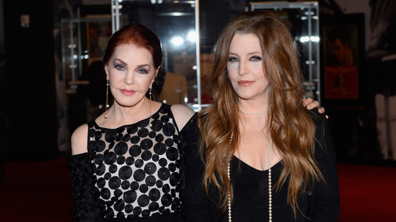 Priscilla Presley and daughter Lisa Marie Presley in black outfits