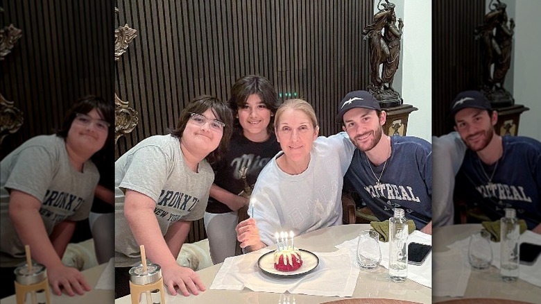 Celine Dion posing with her three sons