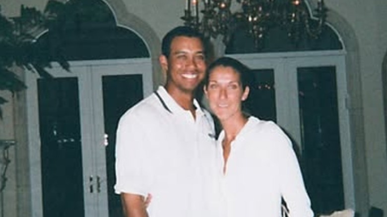 Young Tiger Woods and Celine Dion pose for a photo
