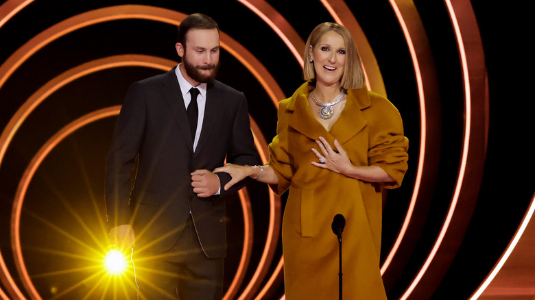 René-Charles Angélil walking with Céline Dion