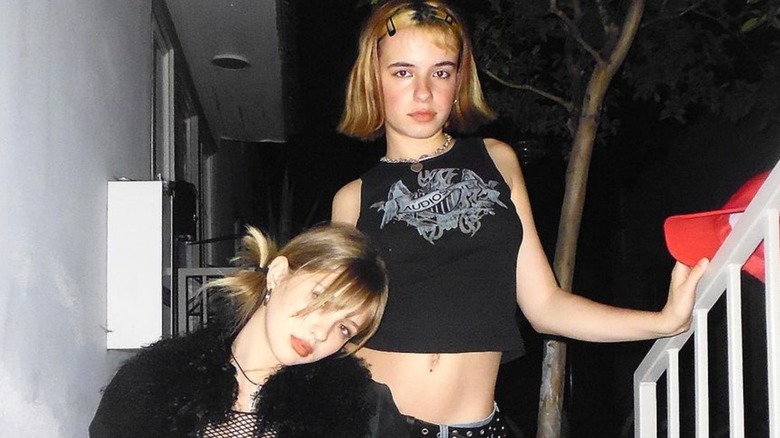 two goth girls posed angstily