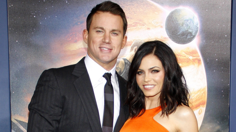 Channing Tatum wearing a suit and Jenna Dewan wearing an orange gown