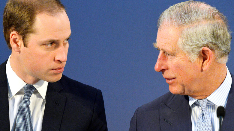 Prince William and Prince Charles at an event. 