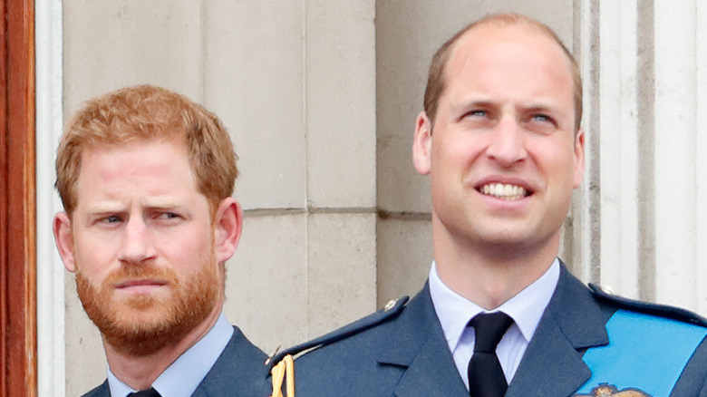 Prince Harry and Prince William standing on balcony of Buckingham Palace