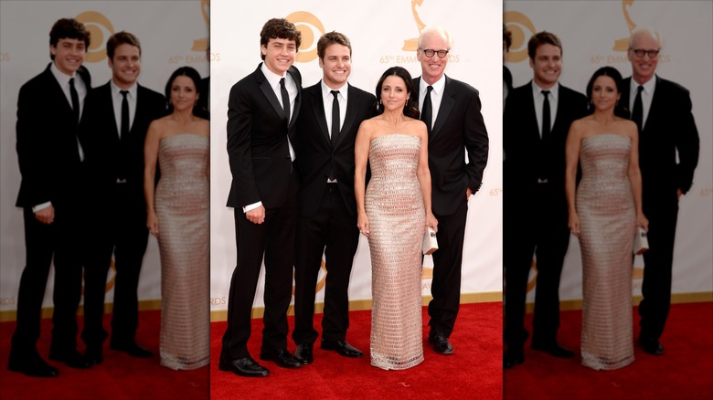 Charlie Hall, Henry Hall, Julia Louis-Dreyfus, and Brad Hall walking the red carpet at the Emmys.