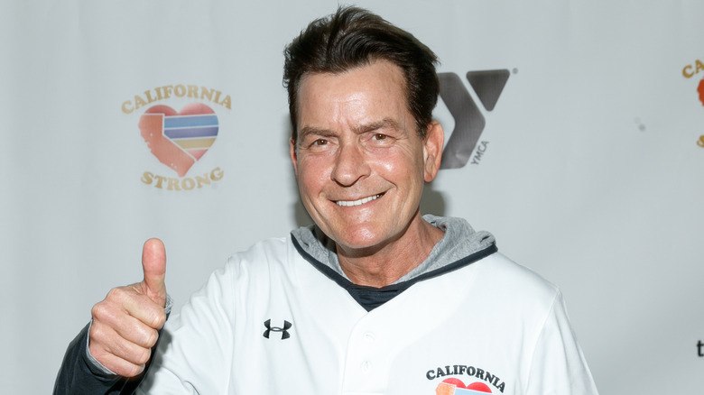 Charlie Sheen smiling, thumbs up