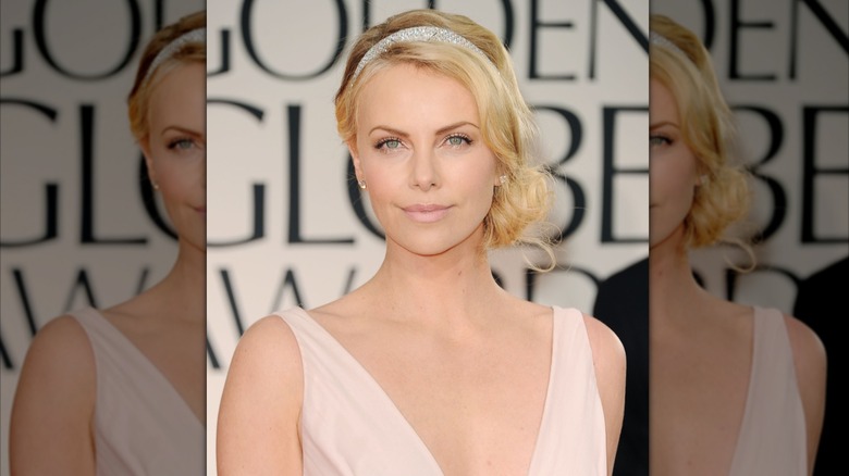 Charlize Theron attends the 2012 Golden Globe Awards