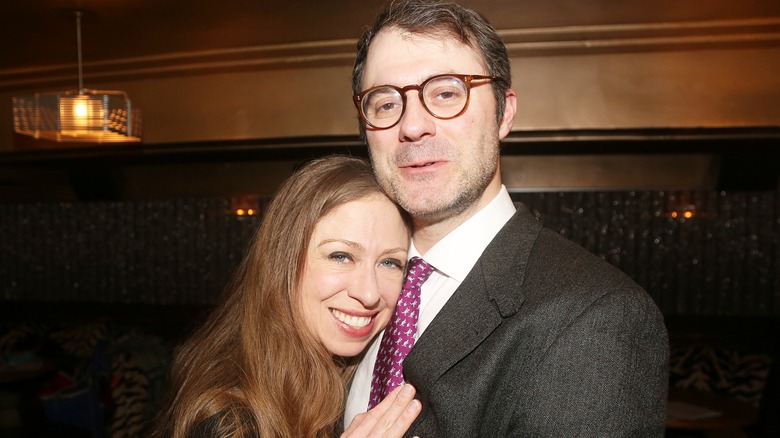 Chelsea Clinton smiling with Marc Mezvinsky
