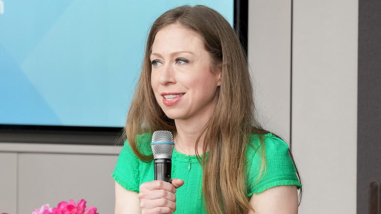 Chelsea Clinton speaking onstage at a Women's Health event