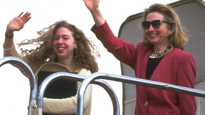 Chelsea and Hillary Clinton waving from a plane