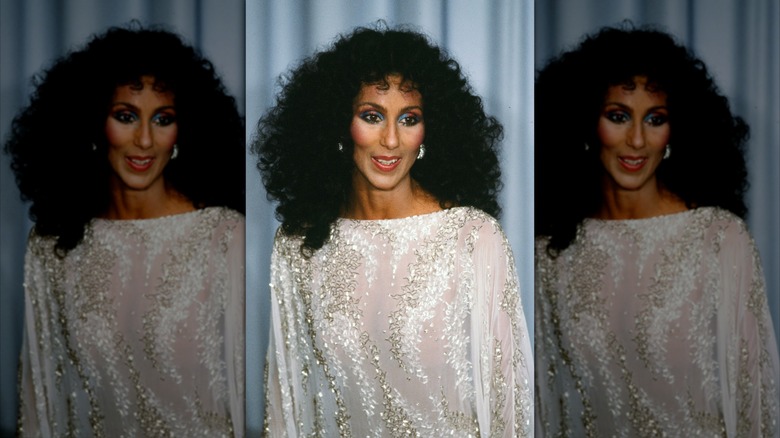 Cher in a sheer white top