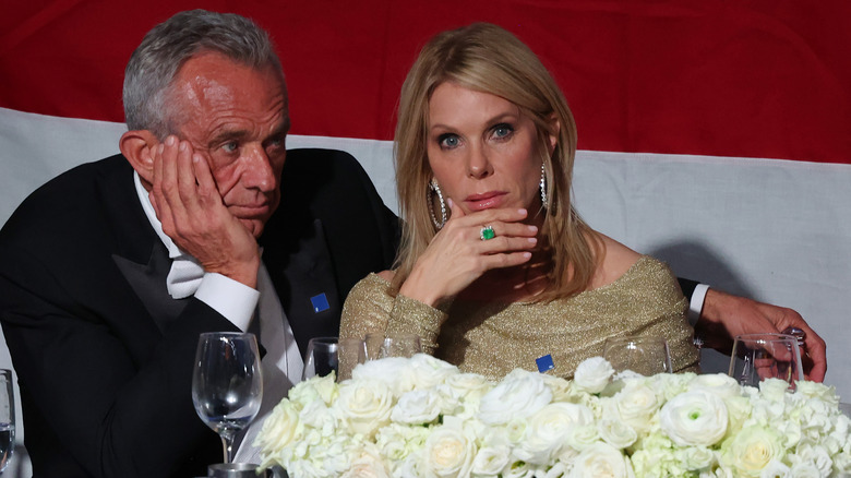 Cheryl Hines looking at the camera with RFK Jr. beside her