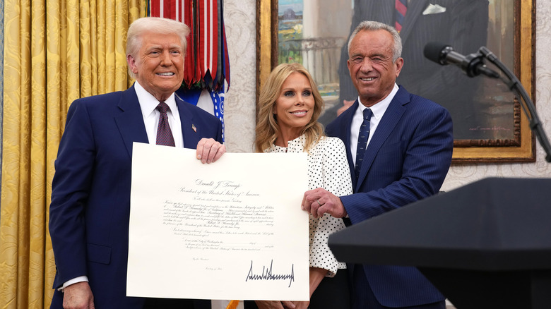 Cheryl Hines and RFK Jr. smiling with Donald Trump