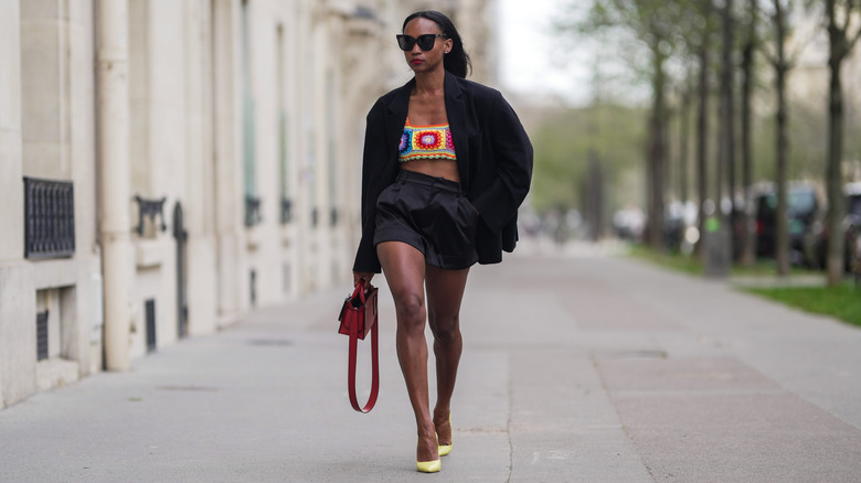 woman wearing shorts with crochet tank