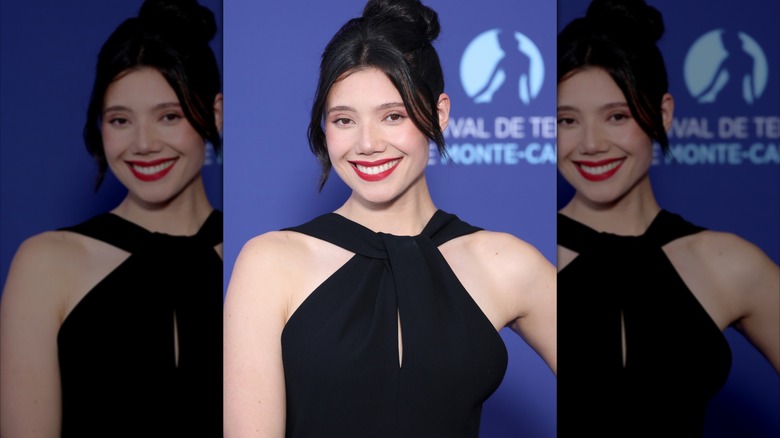 Hanako Greensmith wearing a black dress and smiling.