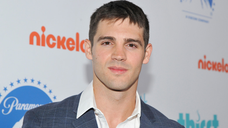 Steven R. McQueen slightly smiling while posing on the red carpet
