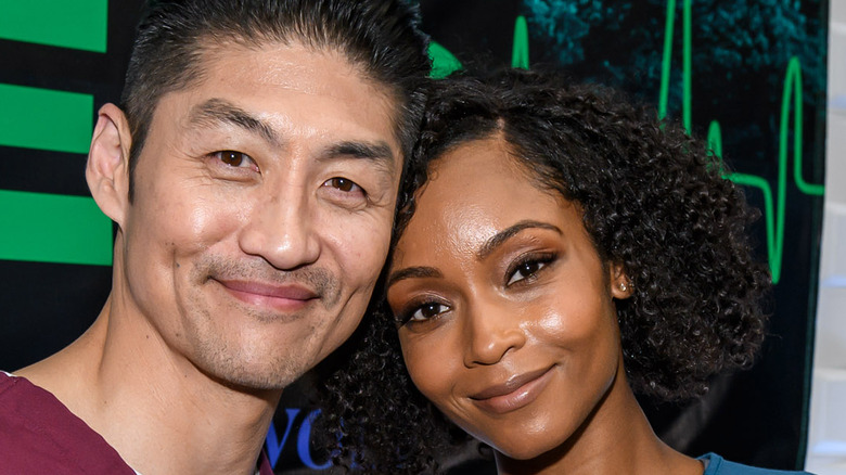 Yaya DaCosta and Brian Tee posing