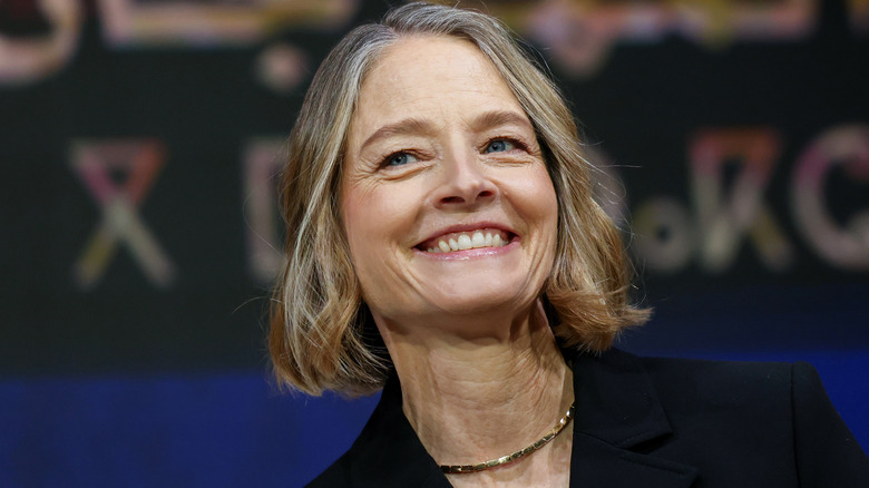 Jodie Foster grinning at a film festival.