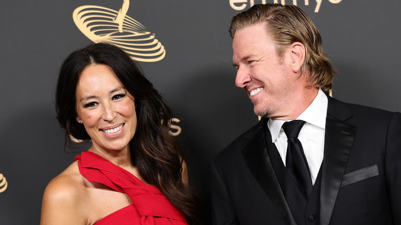 Chip Gaines looking lovingly at Joanna Gaines