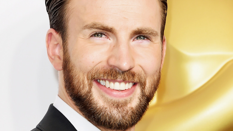 Chris Evans poses on the red carpet