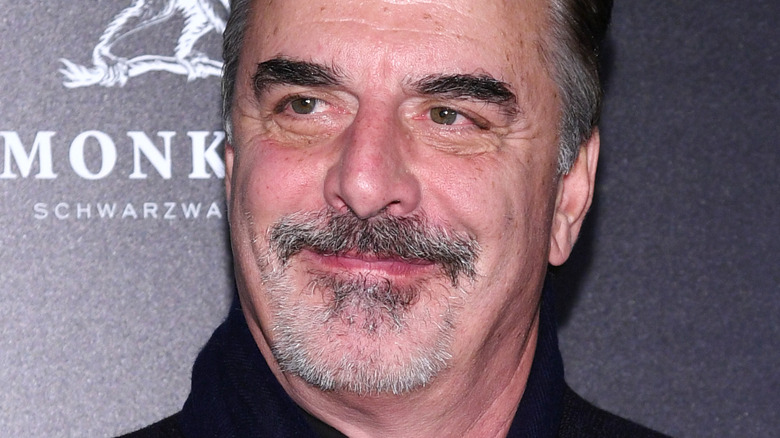 Chris Noth smiling at event