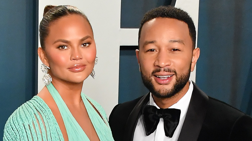 Chrissy Teigen and John Legend posing