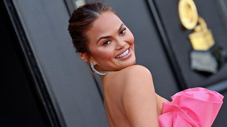 Chrissy Teigen posing on the red carpet