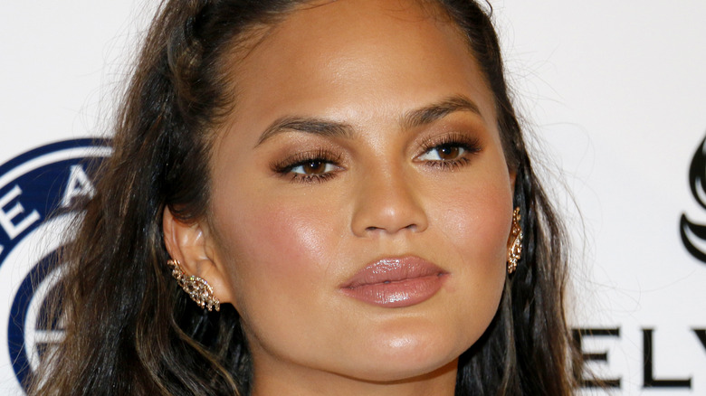 Chrissy Teigen smiles