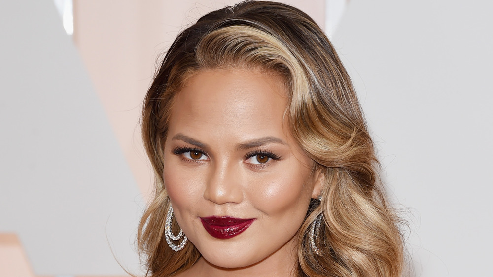 Chrissy Teigen wearing crimson lipstick