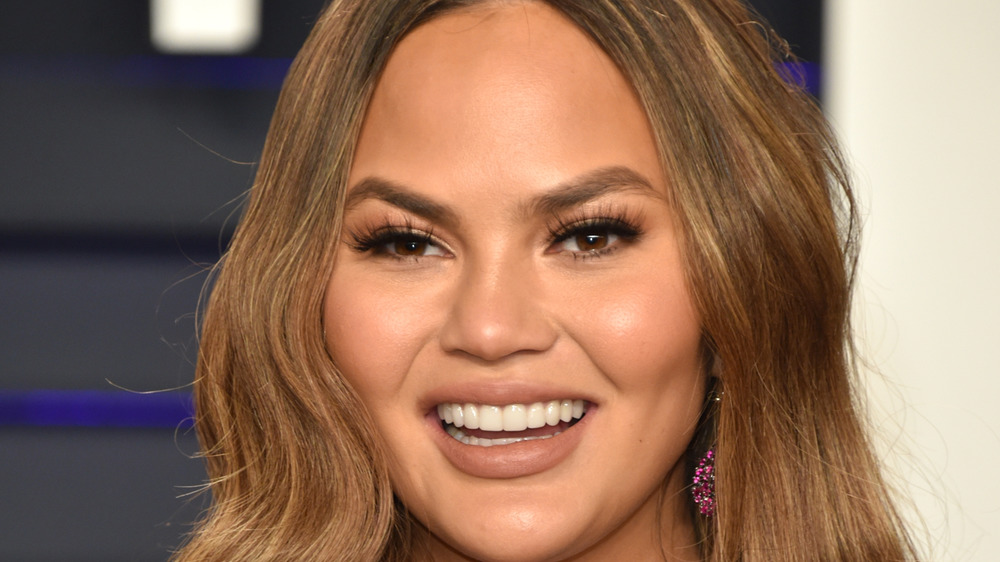 Chrissy Teigen laughs