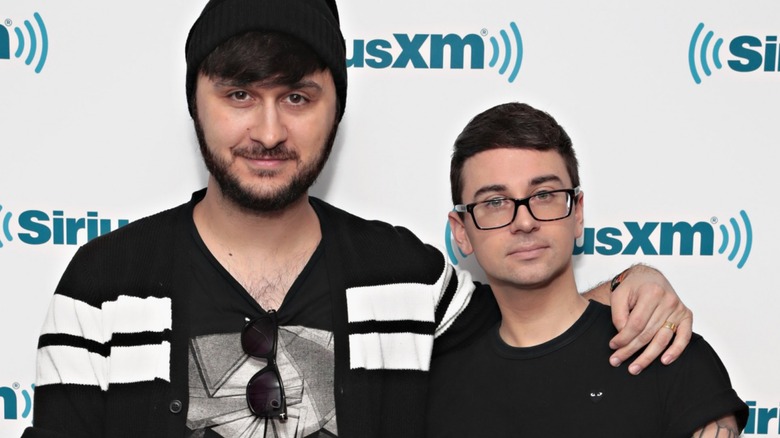 Brad Walsh and Christian Siriano arm-in-arm on a red carpet in 2018