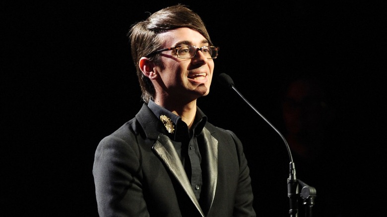 Christian Siriano wearing a black suit while giving a speech in 2011