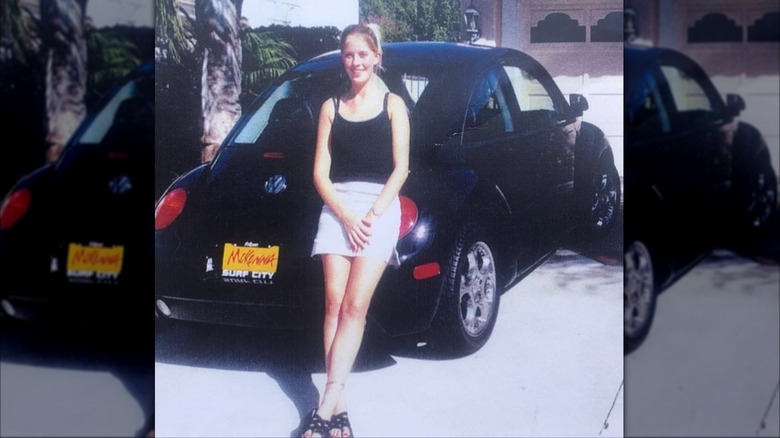 Christina Haack as a teenager leaning on a car
