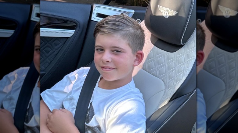 Brayden El Moussa sitting in a Bentley