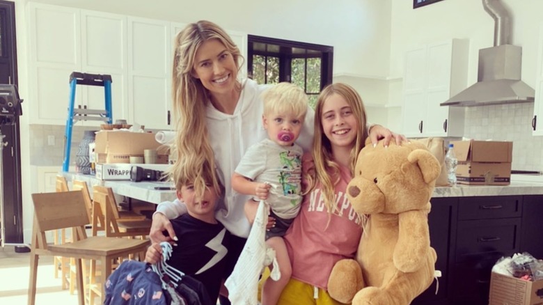 Christina Haack posing with her three kids
