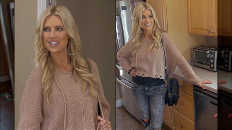 Christina Haack wearing a hoodie-style sweater with a distressed hem