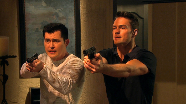 Paul and Andrew with guns drawn