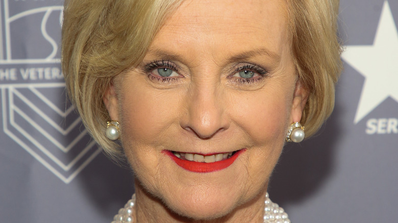 Cindy McCain smiling in pearl earrings