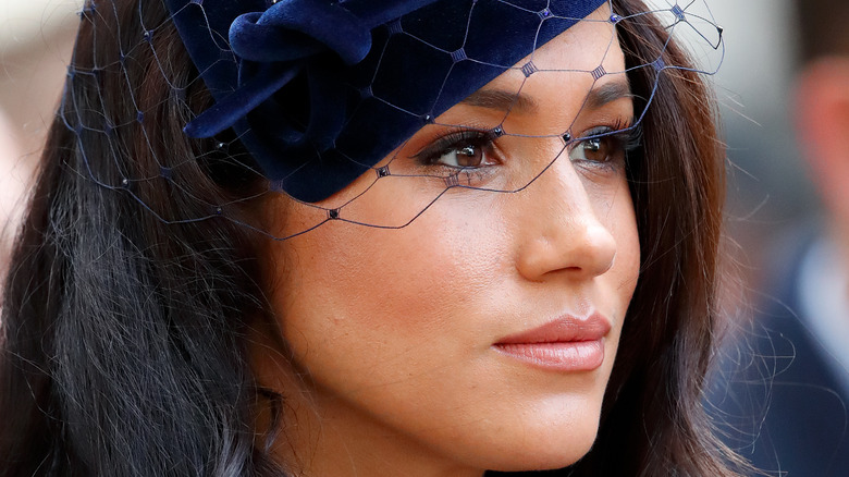 Meghan Markle poses in a hat