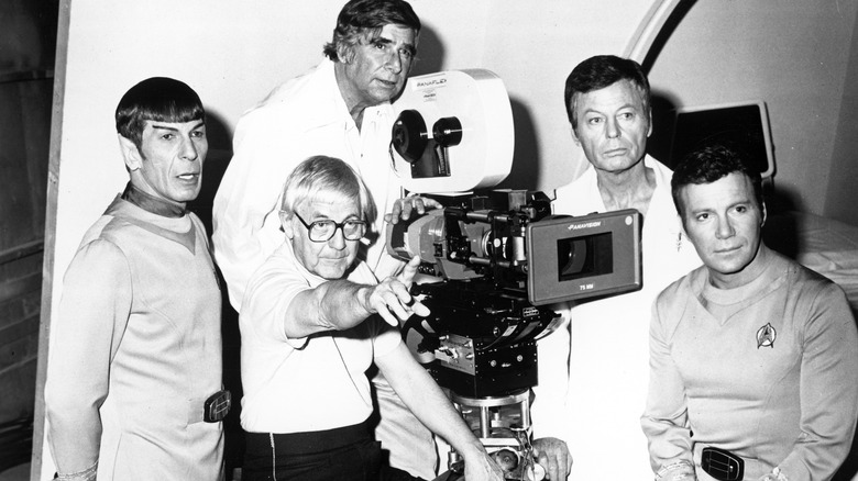 Leonard Nimoy, DeForest Kelly, and William Shatner in a portrait with writer Gene Roddenberry and director Robert Wise filming "Star Trek: the Motion Picture" circa 1979