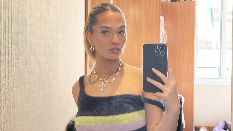 Claudia Conway taking mirror selfie 