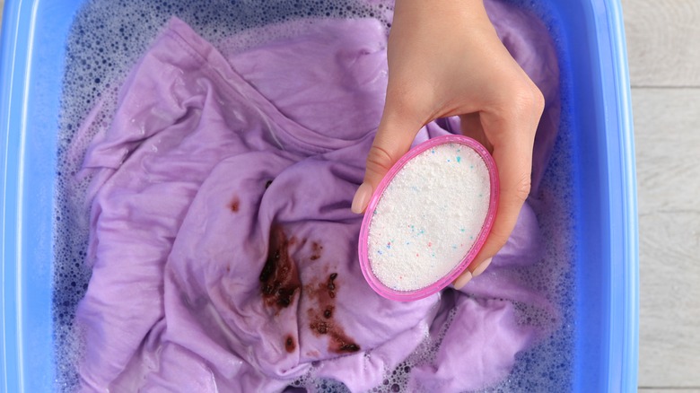 Detergent being added to the washing machine